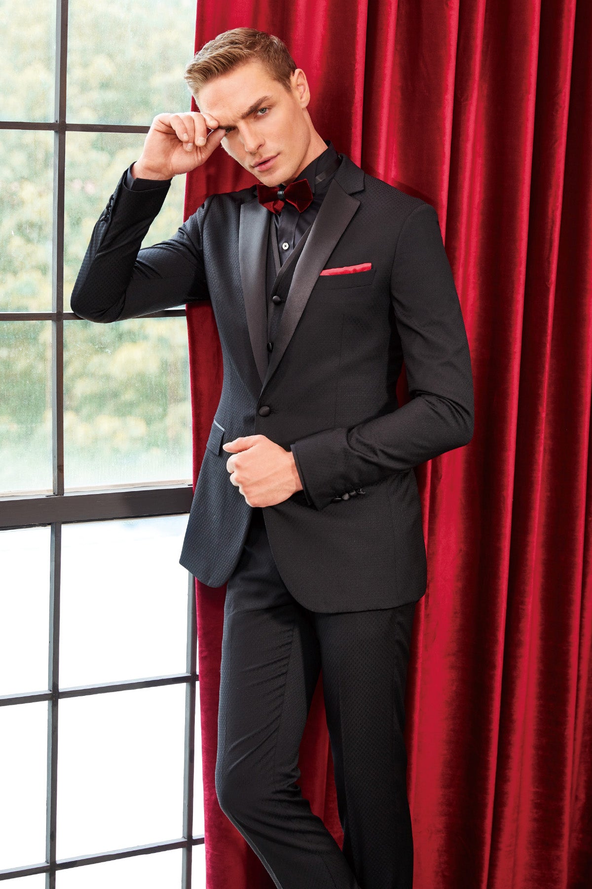 black pant coat with black shirt and red tie